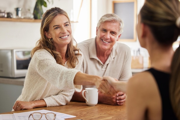 handshake life insurance senior couple with lawyer mortgage tax bills property financial investment finance inheritance old woman shaking hands with realtor successful deal 590464 87013